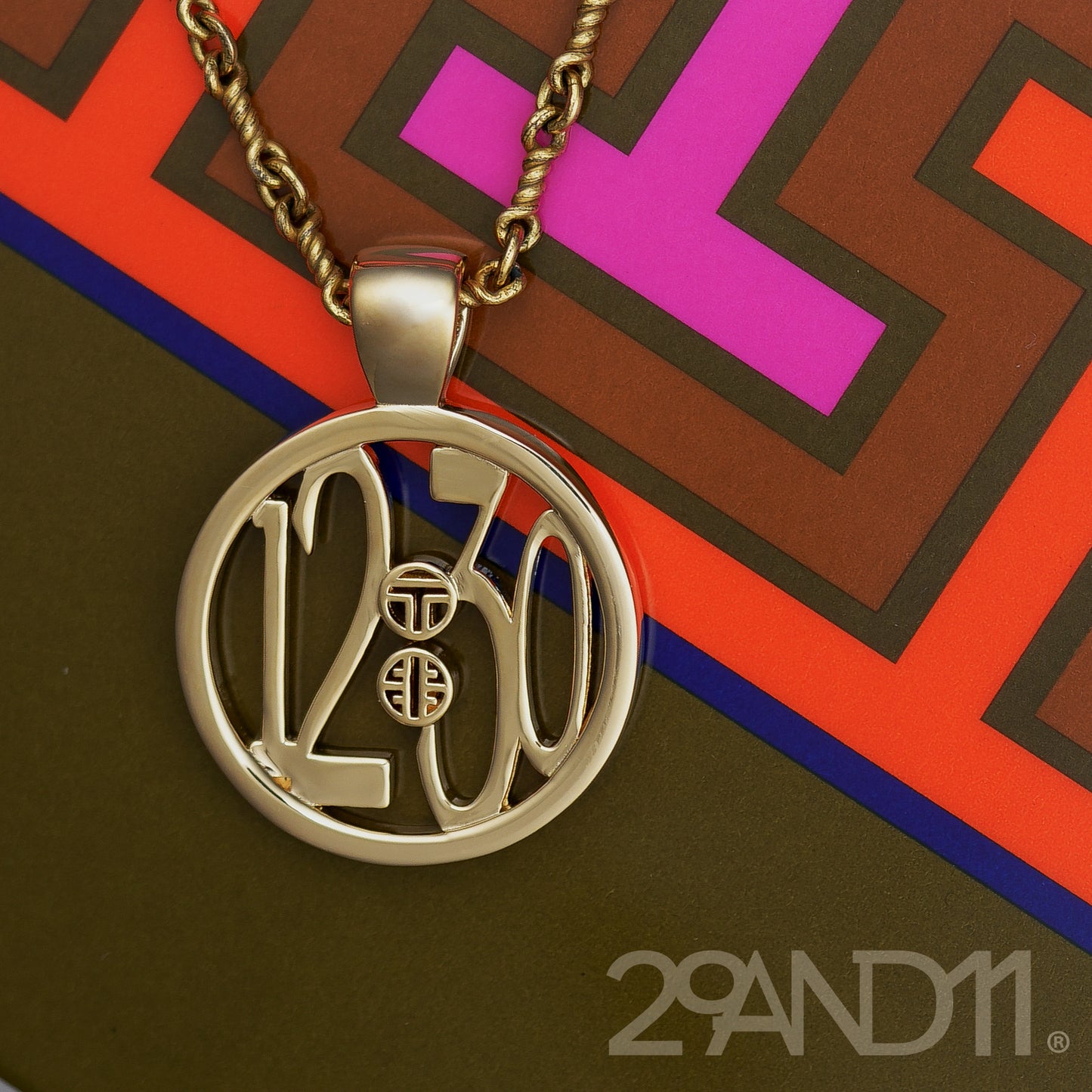 The Ashe is our monogram pendant inspired by our beloved monograms that grace all the thing we love and use daily. The numbers 12 and 30 are stretched vertically to the edges of the pendant.&nbsp; The numbers 12 and 30 are separated by a colon which is represented by our logo. Down the vertical side of the pendant the chapter name 'Mark' is inscribed on the monogram pendant.