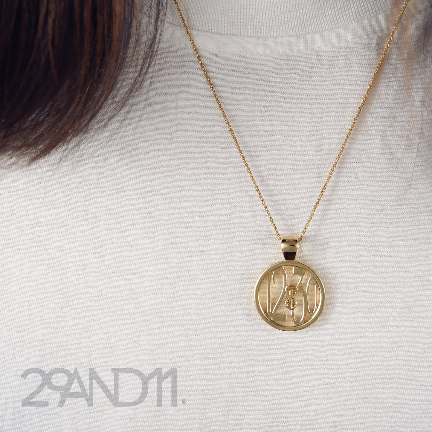 The Ashe is our monogram pendant inspired by our beloved monograms that grace all the thing we love and use daily.&nbsp; The numbers 12 and 30 are stretched vertically to the edges of the pendant.&nbsp; The numbers 12 and 30 are separated by a colon which is represented by our logo.&nbsp; Down the vertical side of the pendant the chapter name 'Mark' is inscribed on the monogram pendant.