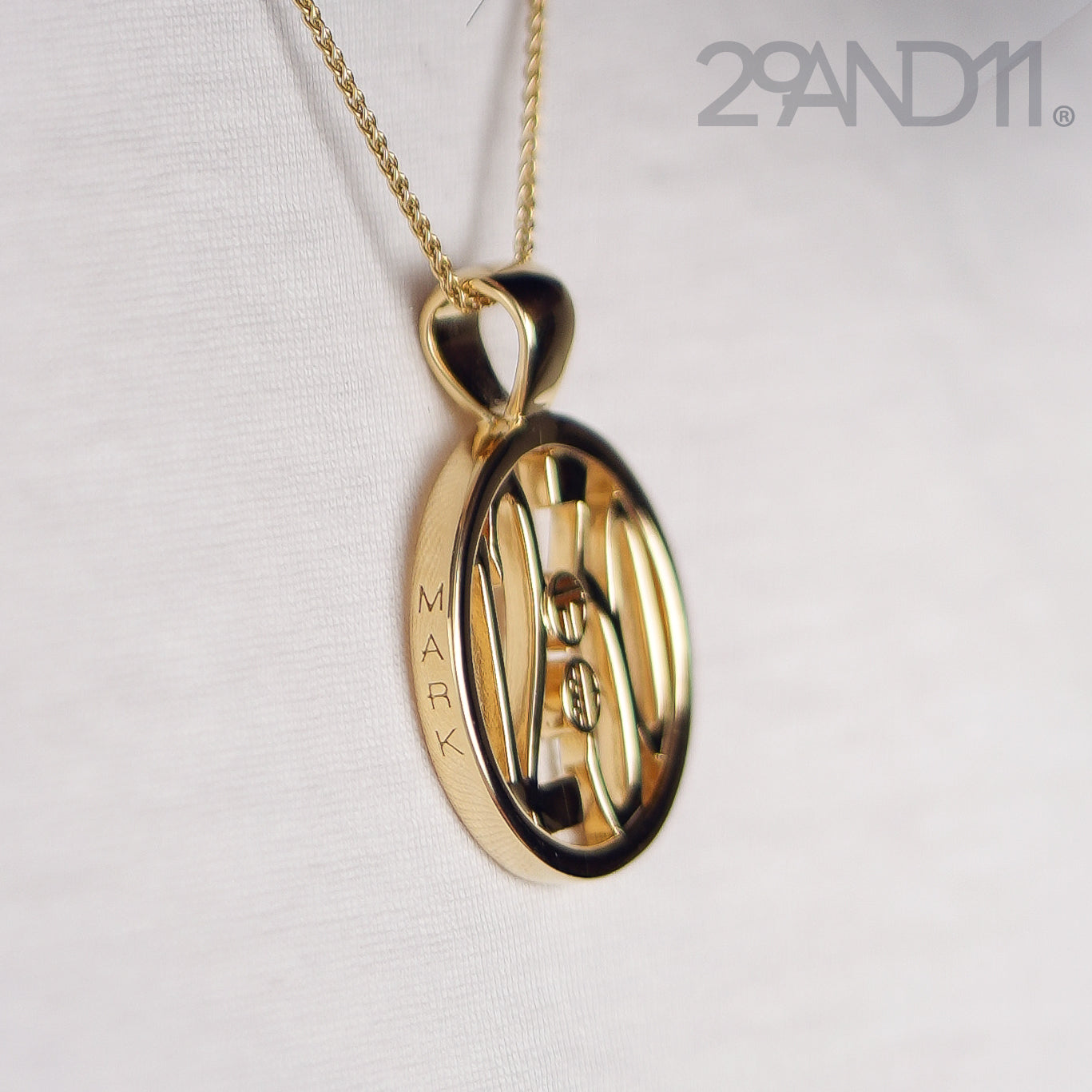 The Ashe is our monogram pendant inspired by our beloved monograms that grace all the thing we love and use daily.&nbsp; The numbers 12 and 30 are stretched vertically to the edges of the pendant.&nbsp; The numbers 12 and 30 are separated by a colon which is represented by our logo.&nbsp; Down the vertical side of the pendant the chapter name 'Mark' is inscribed on the monogram pendant.