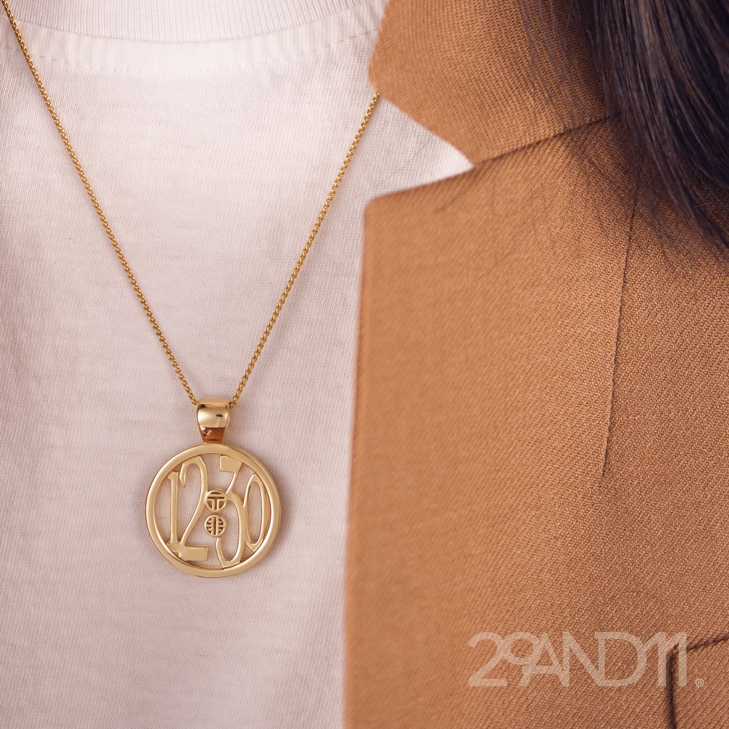 The Ashe is our monogram pendant inspired by our beloved monograms that grace all the thing we love and use daily. The numbers 12 and 30 are stretched vertically to the edges of the pendant. The numbers 12 and 30 are separated by a colon which is represented by our logo. Down the vertical side of the pendant the chapter name 'Mark' is inscribed on the monogram pendant.