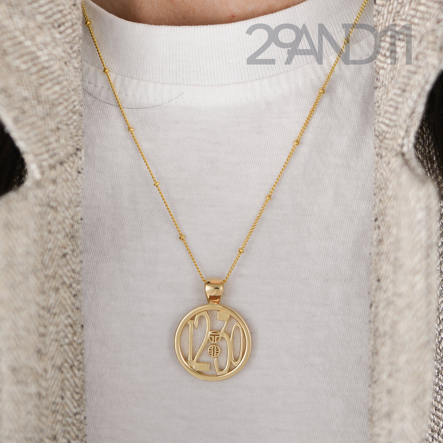 The Ashe is our monogram pendant inspired by our beloved monograms that grace all the thing we love and use daily.&nbsp; The numbers 12 and 30 are stretched vertically to the edges of the pendant.&nbsp; The numbers 12 and 30 are separated by a colon which is represented by our logo.&nbsp; Down the vertical side of the pendant the chapter name 'Mark' is inscribed on the monogram pendant.