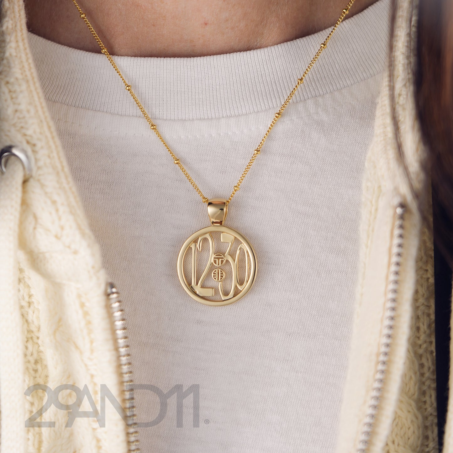 The Ashe is our monogram pendant inspired by our beloved monograms that grace all the thing we love and use daily. The numbers 12 and 30 are stretched vertically to the edges of the pendant.&nbsp; The numbers 12 and 30 are separated by a colon which is represented by our logo. Down the vertical side of the pendant the chapter name 'Mark' is inscribed on the monogram pendant.