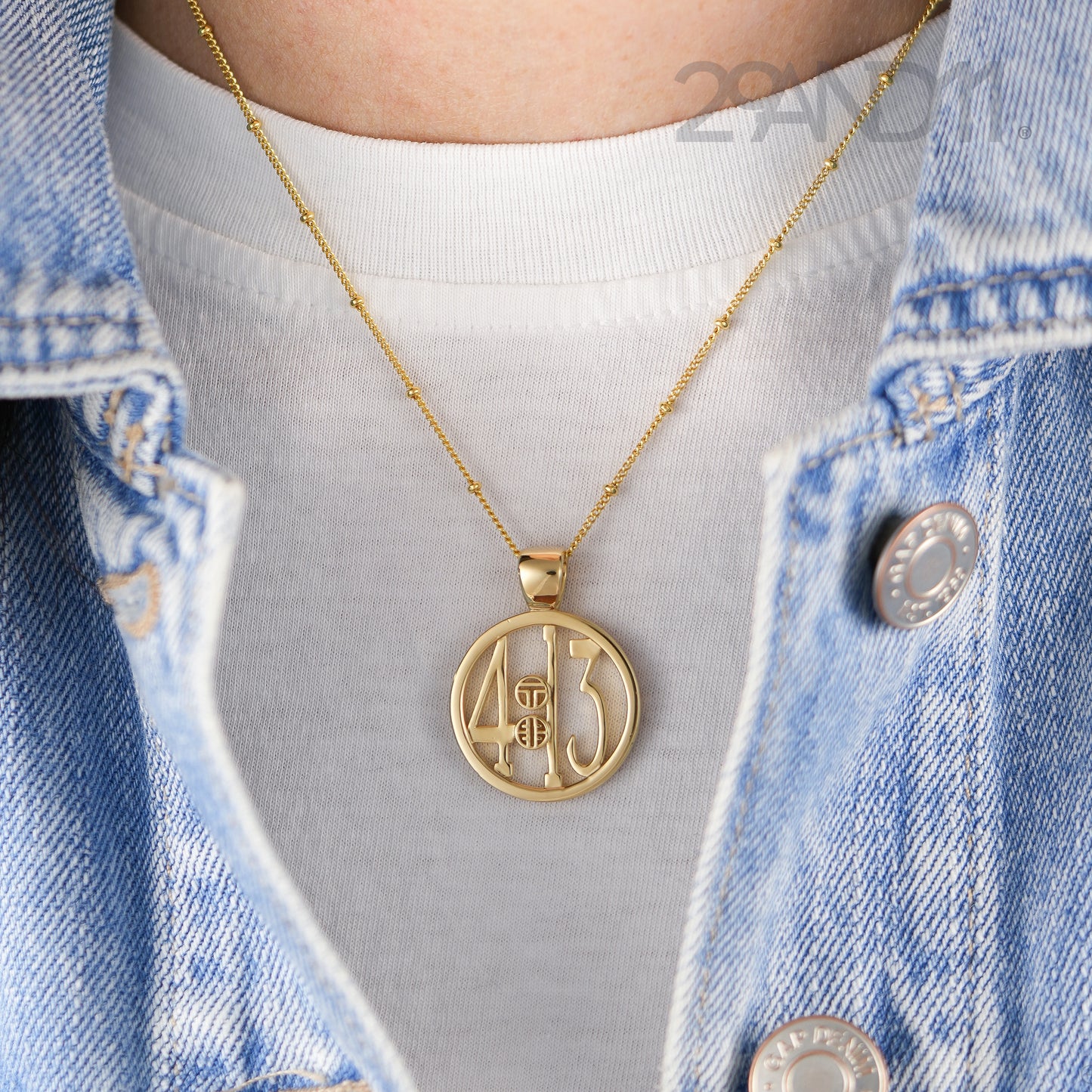 The Ashe is our monogram pendant inspired by our beloved monograms that grace all the thing we love and use daily. The numbers 4 and 13 are stretched vertically to the edges of the pendant. The numbers 4 and 13 are separated by a colon which is represented by our logo. Down the vertical side of the pendant the chapter name 'Philippians' is inscribed on the monogram pendant.