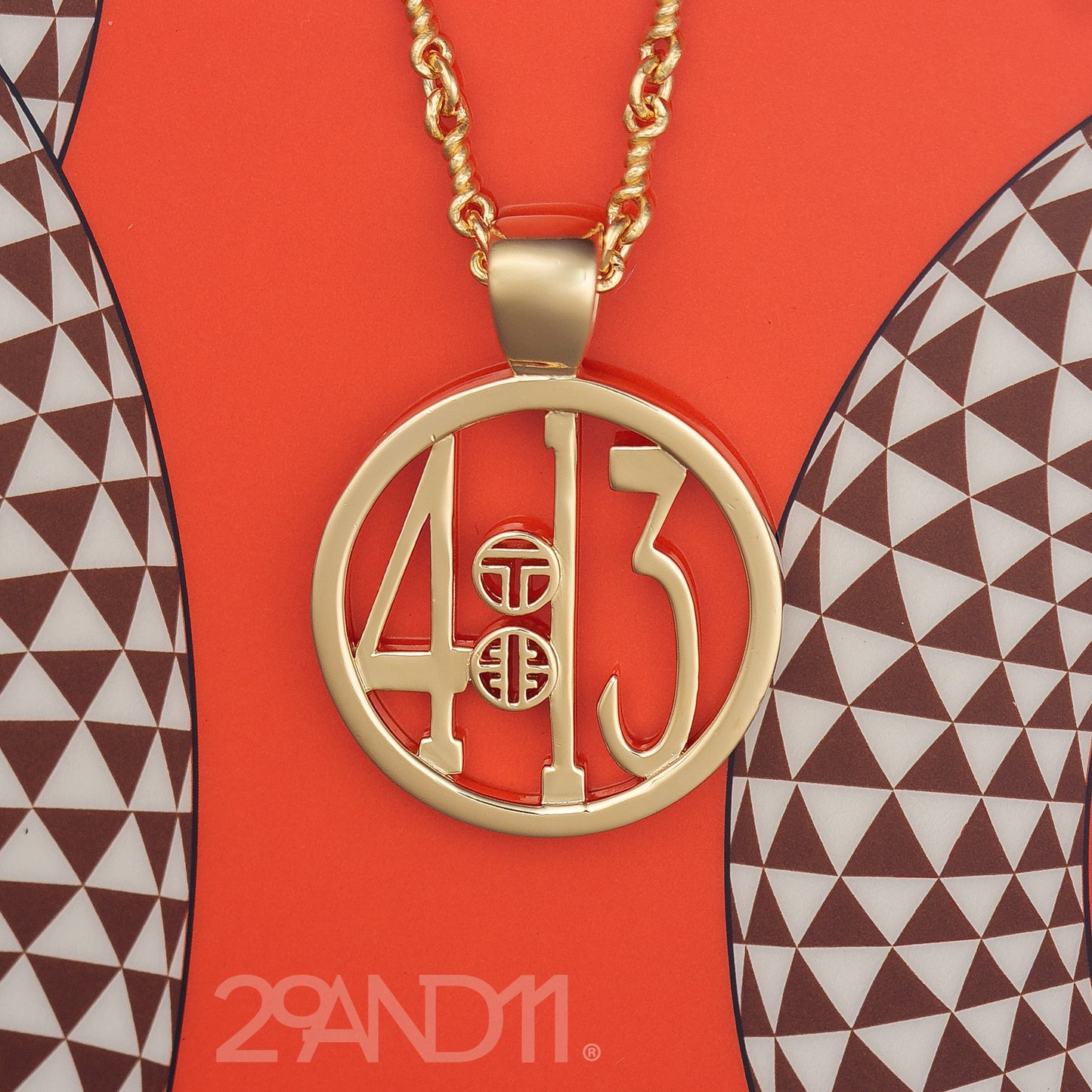 The Ashe is our monogram pendant inspired by our beloved monograms that grace all the thing we love and use daily. The numbers 4 and 13 are stretched vertically to the edges of the pendant. The numbers 4 and 13 are separated by a colon which is represented by our logo. Down the vertical side of the pendant the chapter name 'Philippians' is inscribed on the monogram pendant.