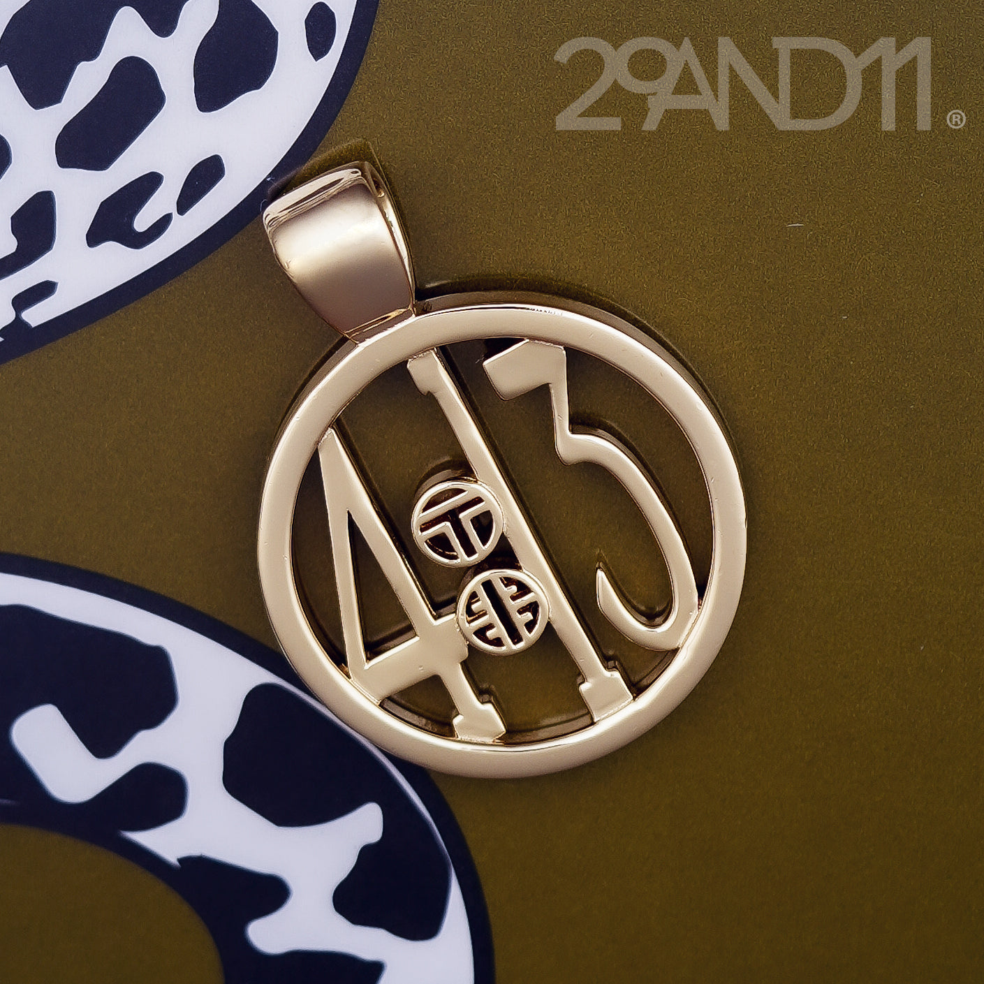 The Ashe is our monogram pendant inspired by our beloved monograms that grace all the thing we love and use daily. The numbers 4 and 13 are stretched vertically to the edges of the pendant. The numbers 4 and 13 are separated by a colon which is represented by our logo. Down the vertical side of the pendant the chapter name 'Philippians' is inscribed on the monogram pendant.