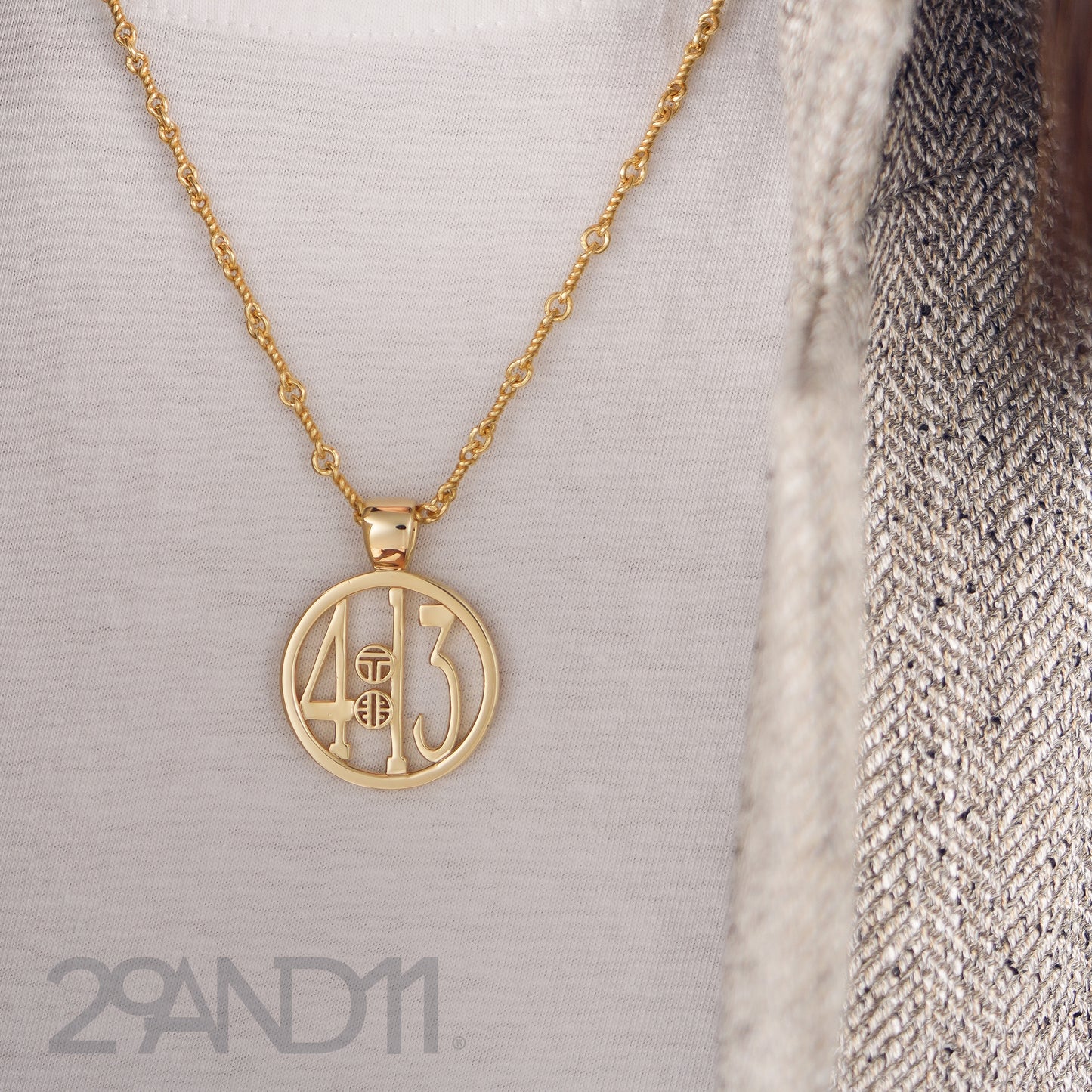 The Ashe is our monogram pendant inspired by our beloved monograms that grace all the thing we love and use daily. The numbers 4 and 13 are stretched vertically to the edges of the pendant. The numbers 4 and 13 are separated by a colon which is represented by our logo. Down the vertical side of the pendant the chapter name 'Philippians' is inscribed on the monogram pendant.