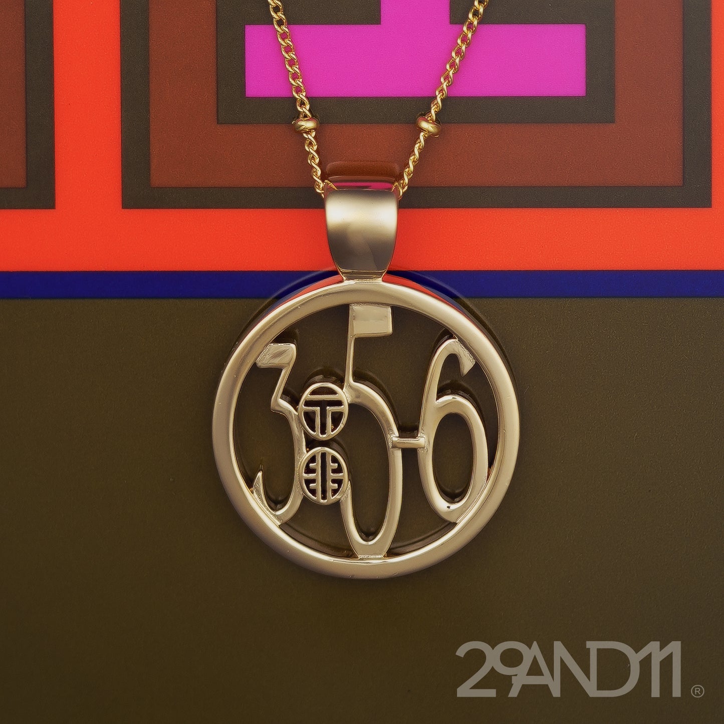 The Ashe is our monogram pendant inspired by our beloved monograms that grace all the thing we love and use daily. The numbers 3, 5, and 6 are stretched vertically to the edges of the pendant. The numbers 3, 5, and 6 are separated by a colon which is represented by our logo.Down the vertical side of the pendant the chapter name Proverbs is inscribed on the monogram pendant.