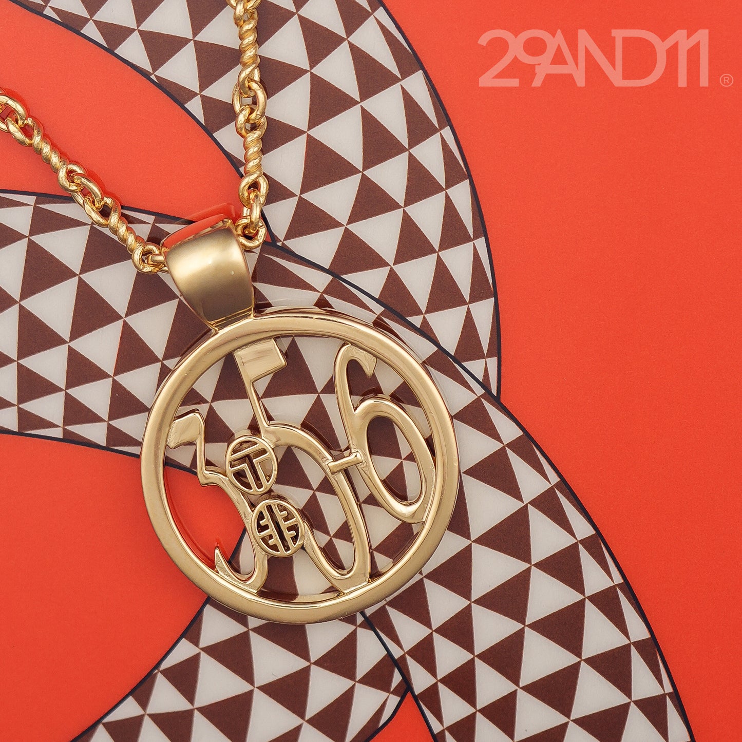 The Ashe is our monogram pendant inspired by our beloved monograms that grace all the thing we love and use daily. The numbers 3, 5, and 6 are stretched vertically to the edges of the pendant. The numbers 3, 5, and 6 are separated by a colon which is represented by our logo.Down the vertical side of the pendant the chapter name Proverbs is inscribed on the monogram pendant.  Model is wearing the pendant on a 18" Rolo chain.